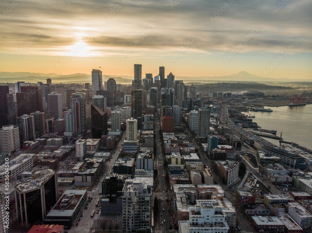 Cityscape of Seattle surrounded by the sea in the evening