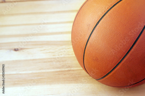Selected focus Basketball ball on a wooden parquet close-up background