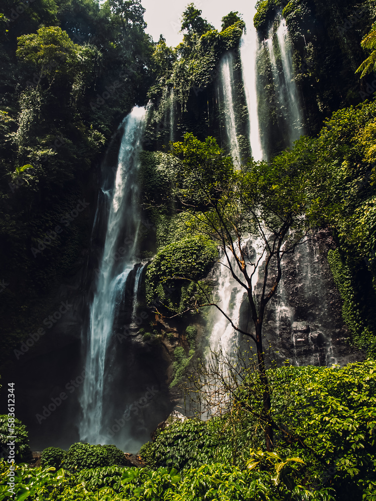 Vertical shot of the high cascades of Sekumpul Waterfalls in Bali, Indonesia