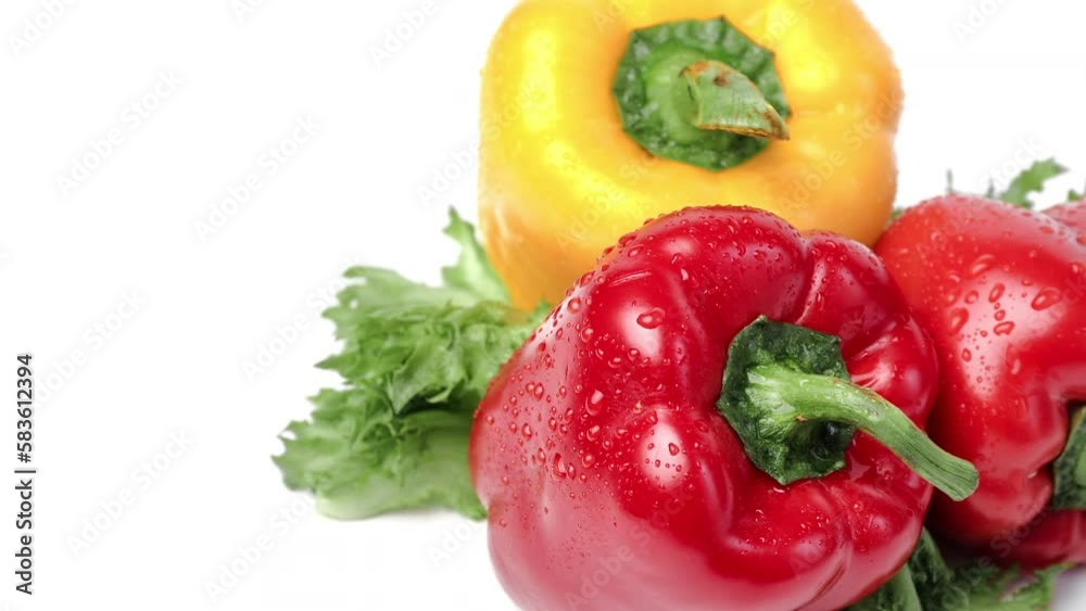 Bell pepper with lettuce fresh organic raw edible plant wet drop rotation isolated on white closeup Bell pepper with lettuce fresh organic raw edible plant wet drop rotation isolated on white closeup