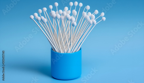 cotton buds on a blue background sanitary qtip hygenic accessory plastic waste
