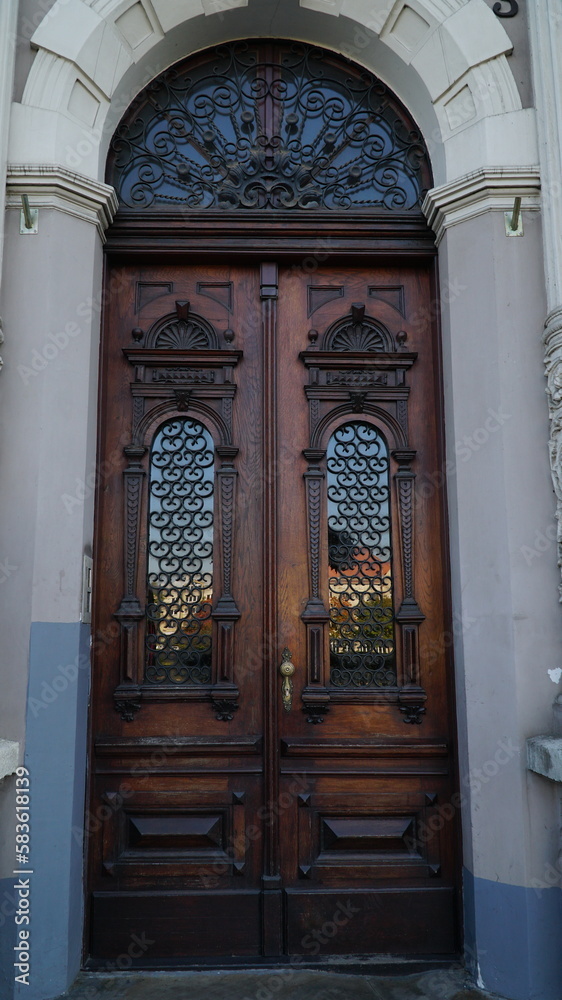 door. Big Double Arch Door. old wooden Front Door of a Traditional European Town House. Old entrance door in a small town