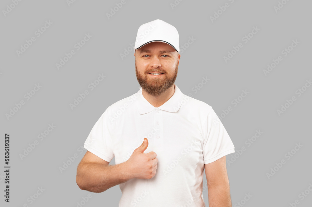 Close up portrait of a smiling young delivery bearded man showing thumb up. Close up portrait of a smiling young delivery bearded man showing thumb up.