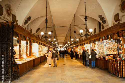 Krakow, Poland - 6th march, 2023: tourist buy souvenirs in famous cloth hall market tourist attraction