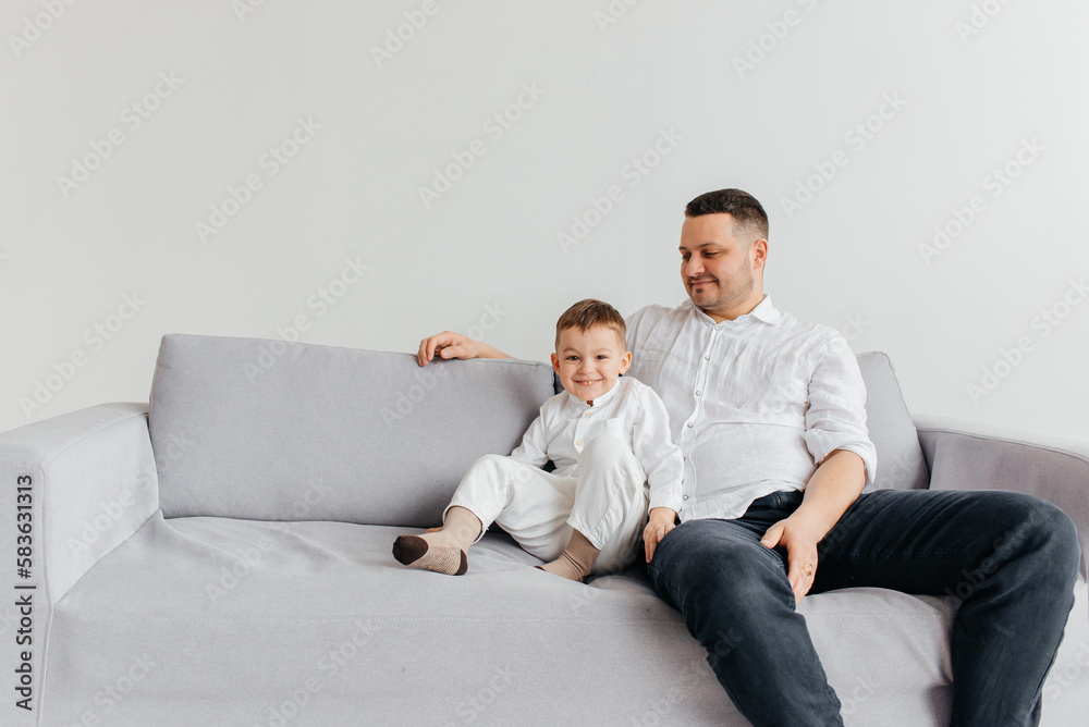 Loving young Caucasian father play have fun with excited small preschooler son in living room at home. Happy dad feel playful enjoy family weekend activity engaged in funny game with 6s boy child. Loving young Caucasian father play have fun with excited small preschooler son in living room at home. Happy dad feel playful enjoy family weekend activity engaged in funny game with 6s boy child.