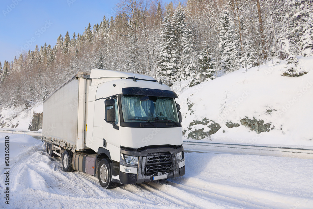 Transport truck stuck in the snow at the cold winter Transport truck stuck in the snow at the cold winter