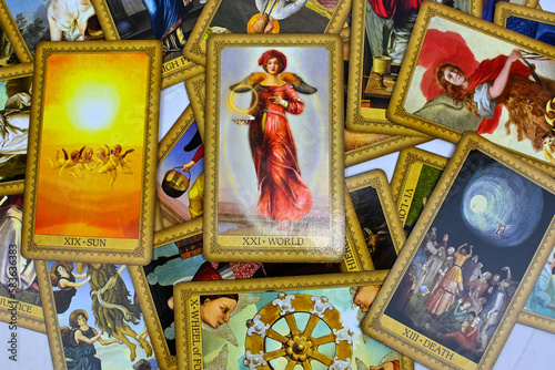 Bangkok, Thailand 14 feb23, Influence Of The Angels Tarot spreading with the world, the best card on top, wheel of fortune. Intuition spiritual new age tarot reading advices forecasting.