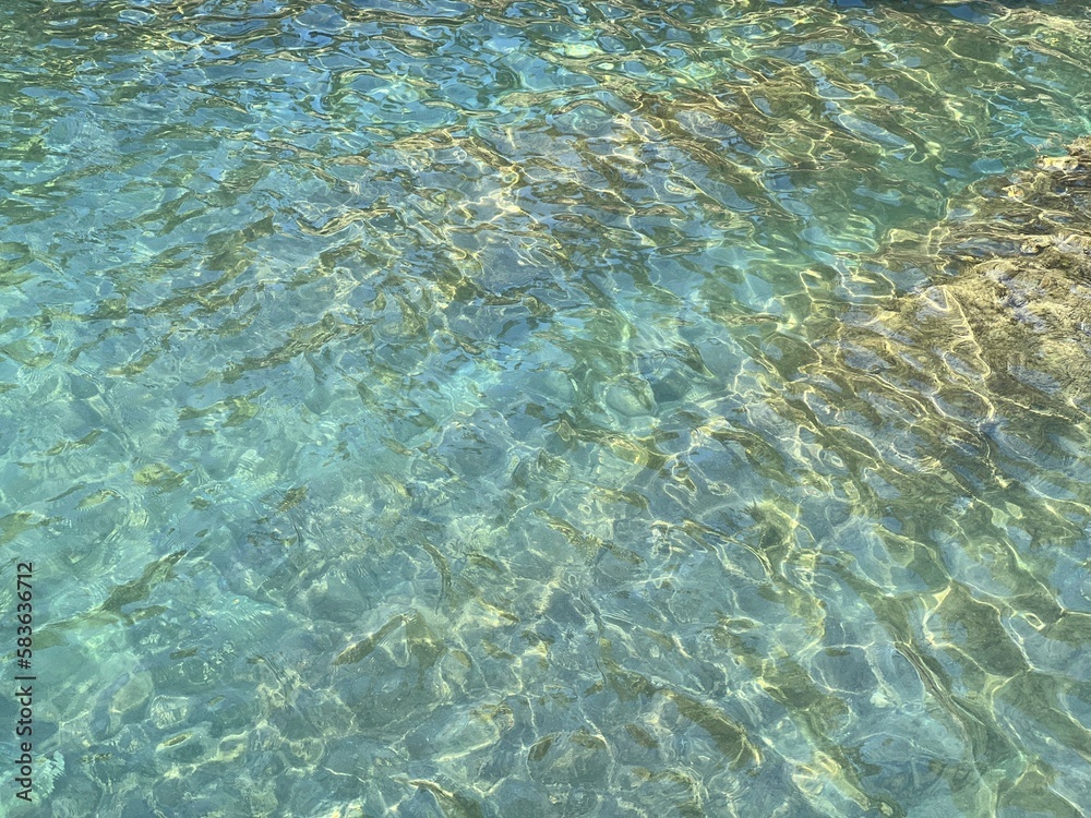 Turquoise sea water clear surface.