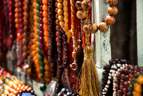 Rosaries lined up on the counter of a rosary seller in Istanbul.