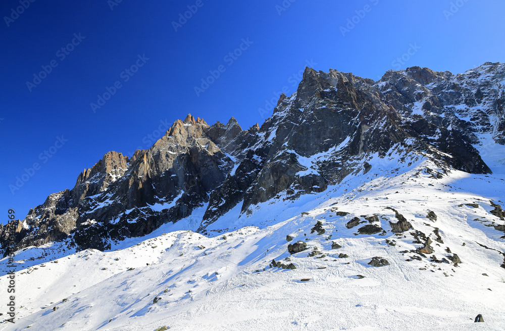 View of the Mont Blanc massif seen from the Aiguille Plan. French Alps, Europe.