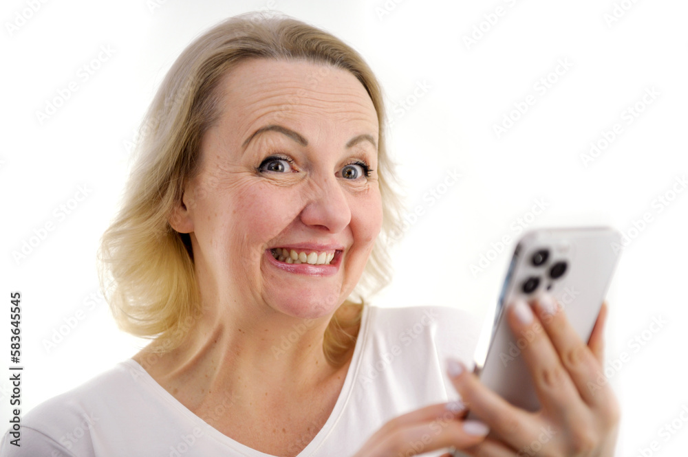 Portrait photo of beautiful woman feeling happy or surprise shock and holding smart phone with black empty screen on white background can use for advertising or product presenting concept. Portrait photo of beautiful woman feeling happy or surprise shock and holding smart phone with black empty screen on white background can use for advertising or product presenting concept.