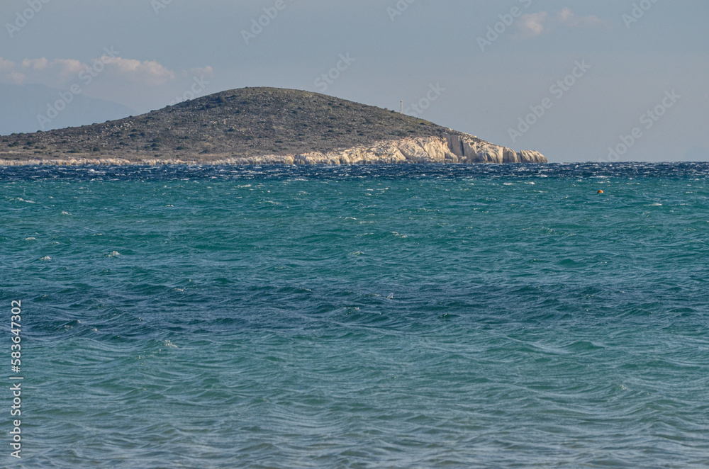 scenic view of Bozolan Burnu from Çark Plajı Beach in Alacati (Cesme, Izmir province, Turkey)