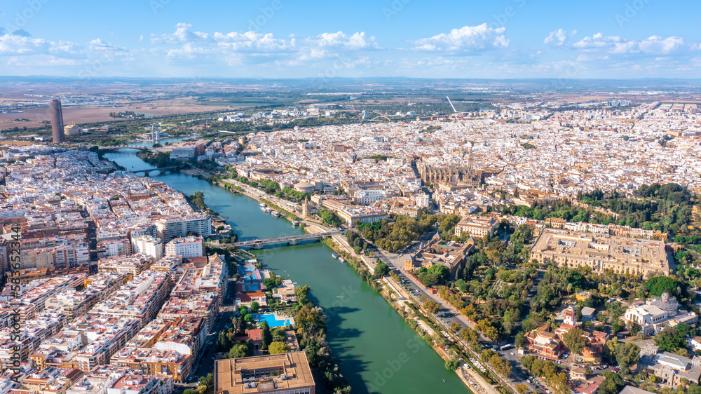 Aerial view of the Spanish city of Seville in the Andalusia region on river Guadaquivir overlooking cathedral and Real Alcazar