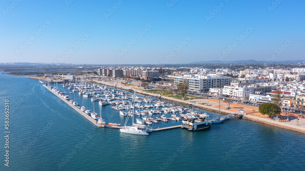 Aerial view of Portuguese fishing tourist town of Olhao overlooking the Ria Formosa Marine Park. sea port for yachts