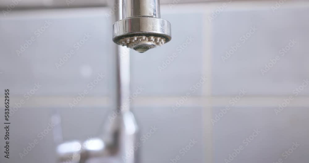 Falling drops of water from a leaking tap. Falling drops of water from a leaking tap.