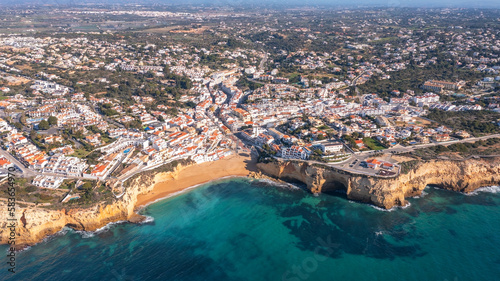 Aerial view of portuguese tourist village Carvoeiro Portugal Algarve in summer on a sunny day. beach for tourists and vacationers