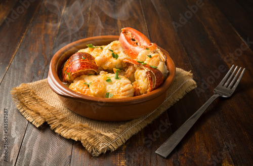 Obraz na plátně Caldereta de bogavante y rape