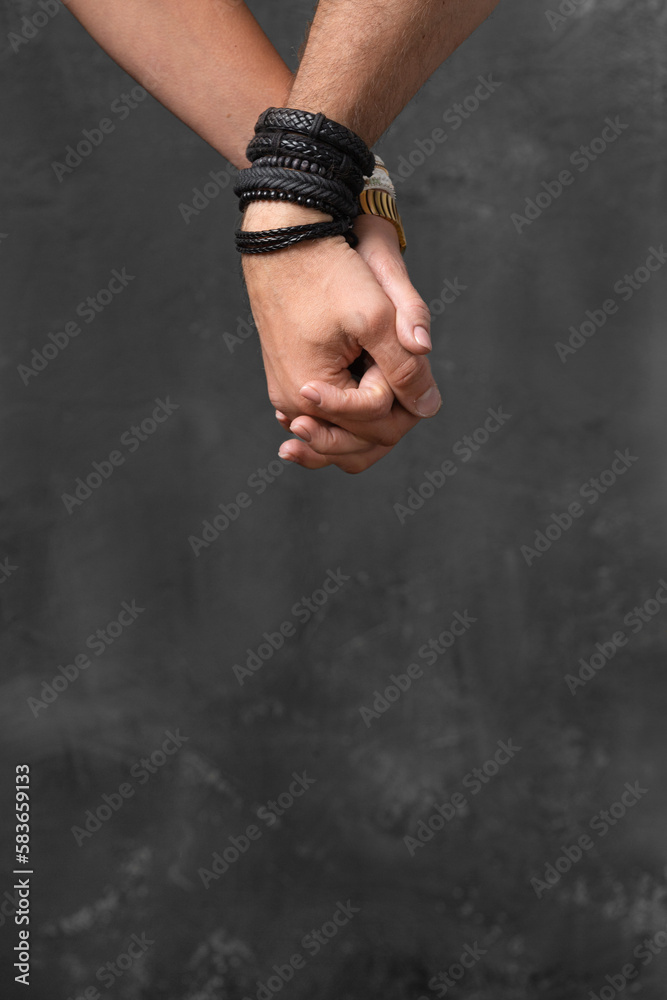 Man's hand and girl's hand holding together close up