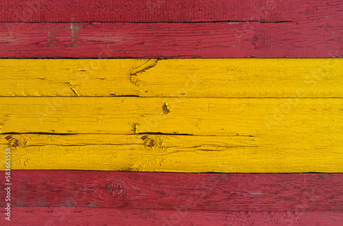 Spain flag texture on wooden boards. Boards painted in red and yellow