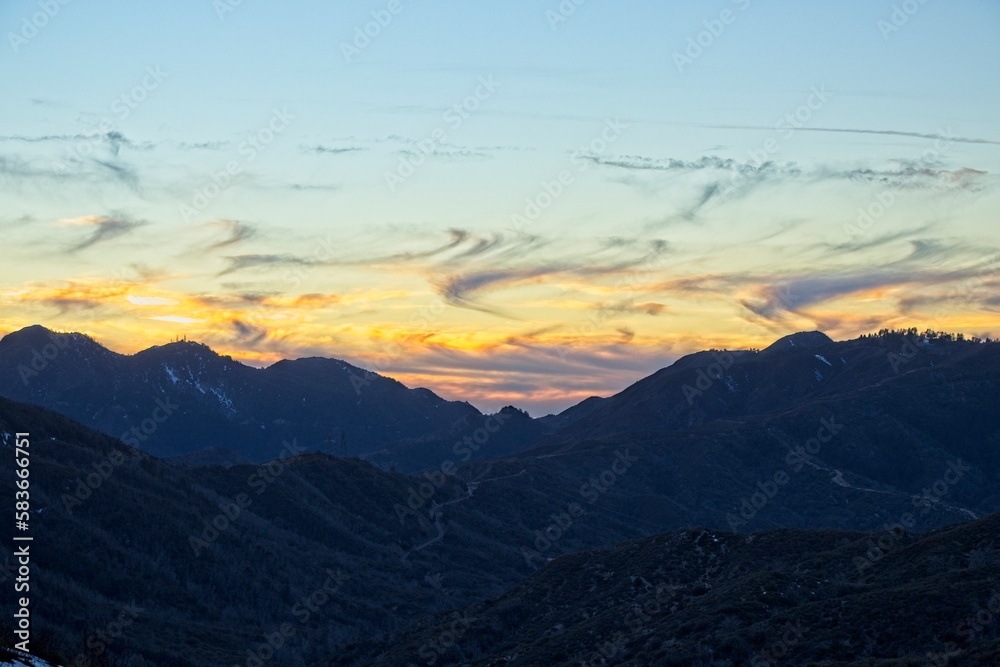 The sun sets and dusk falls on the Angeles Crest Highway, a winding route through the San Gabriel Mountains and Angeles National Forest just north of Los Angeles The sun sets and dusk falls on the Angeles Crest Highway, a winding route through the San Gabriel Mountains and Angeles National Forest just north of Los Angeles