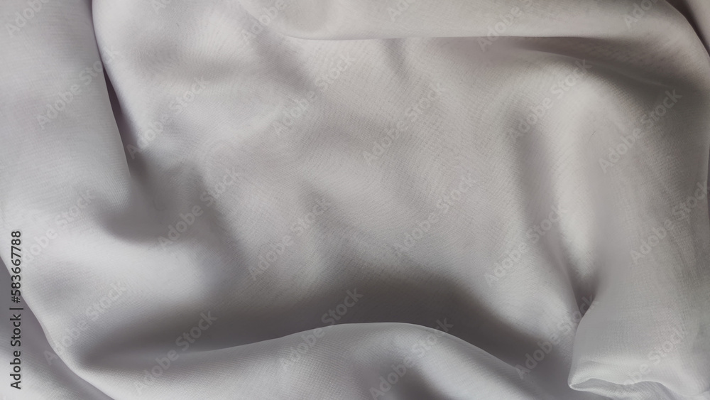 Fototapeta premium Abstract chiffon fabric background white texture from the waves and the irregularities that create the frame. Light, delicate, beautiful curtains