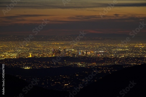 Dusk falls on Los Angeles far below us, from the Angeles Crest Highway in the San Gabriel Mountains © Andrew