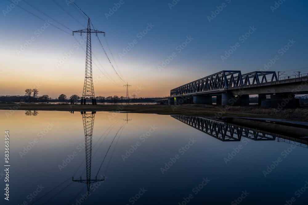 Reflection of the Elbe railway bridge in the evening