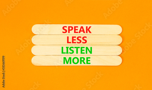 Speak less listen more symbol. Concept words Speak less listen more on wooden stick. Beautiful orange table orange background. Motivational business speak less listen more concept. Copy space.