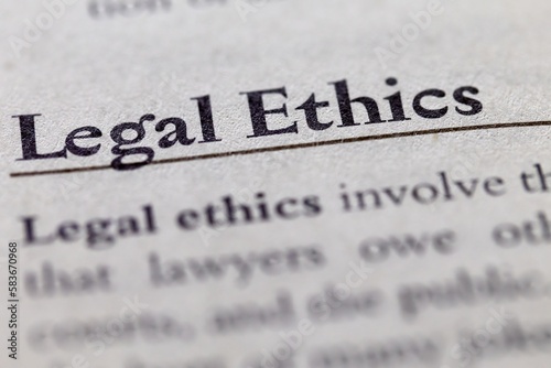 legal or law book with legal ethics focused in closeup of explanation photo