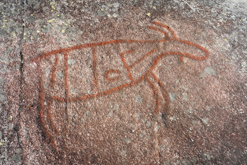 Petroglyphs of an elk oxen by Møllerstufossen Waterfalls in the Etna River, Oppland, Norway.