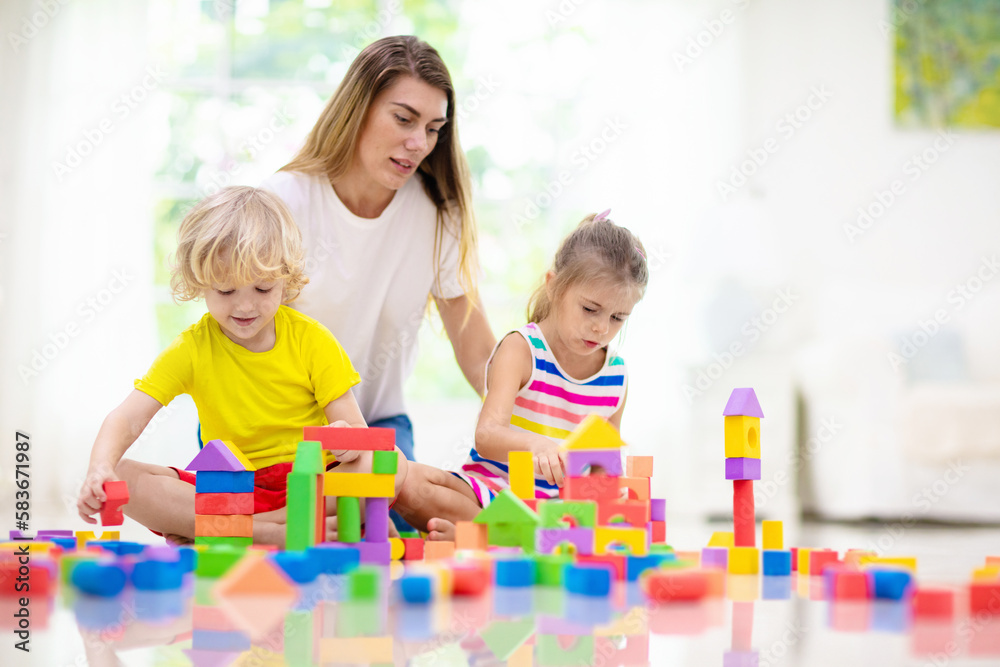 Kids play with toy blocks. Family at home. Kids play with toy blocks. Family at home.