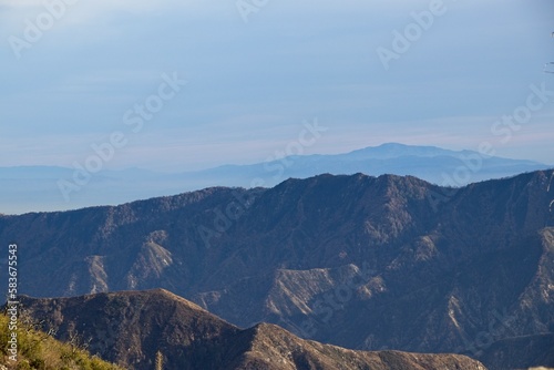 The winding Angeles Crest Highway provides views over the Los Angeles Basin and surrounding urban valleys, the snow-dusted San Gabriel and San Bernandino Mountains and the Mojave Desert photo