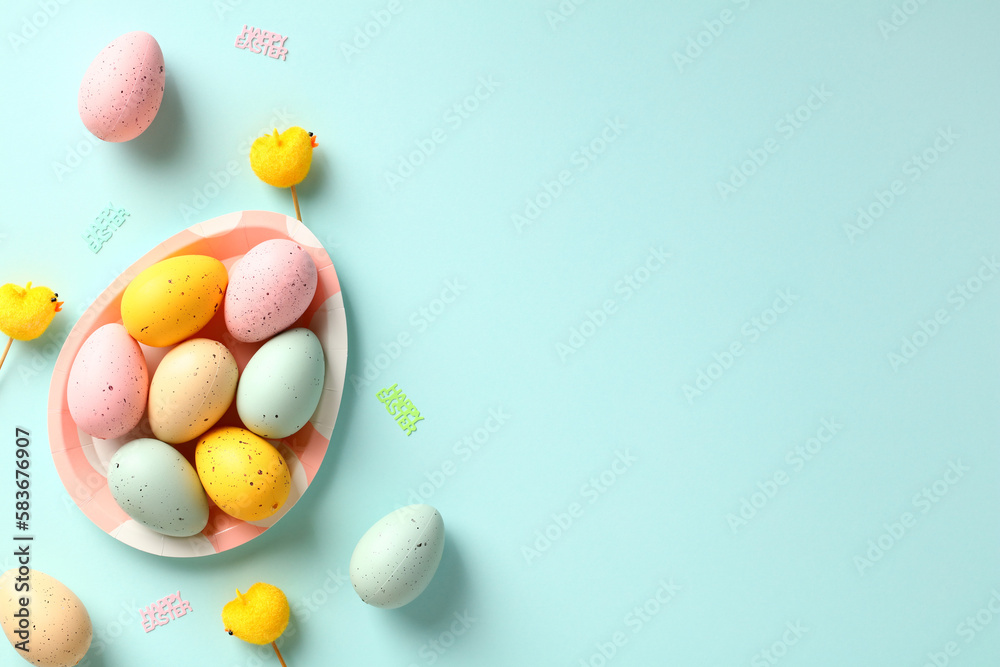 Happy Easter banner template. Creative layout with colorful Easter eggs on blue background. Flat lay, top view.