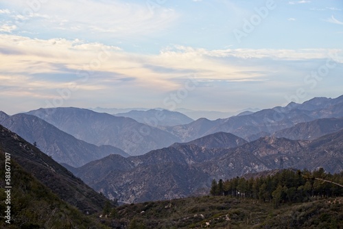 The winding Angeles Crest Highway provides views over the Los Angeles Basin and surrounding urban valleys  the snow-dusted San Gabriel and San Bernandino Mountains and the Mojave Desert