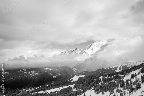 Cloudy snowy mountain in black and white