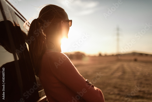Thoughtful young woman watching the sunset  © kieferpix