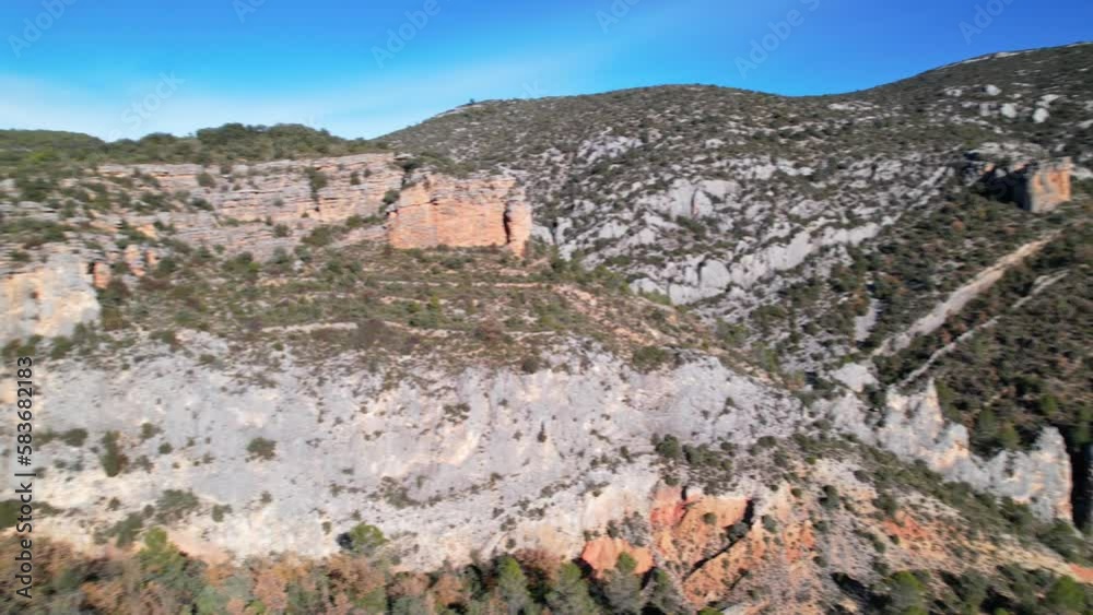 Panorama aerial view flying drone shot over beautiful scenery forested hills near Finestras uninhabited village and , located in Huesca province, border between Catalonia and Aragon, Spain. 4K video Panorama aerial view flying drone shot over beautiful scenery forested hills near Finestras uninhabited village and , located in Huesca province, border between Catalonia and Aragon, Spain. 4K video