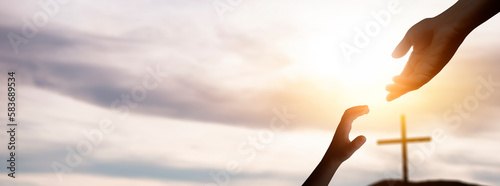 the hand of god helping and giving hope to a child, in a background with the cross of christ