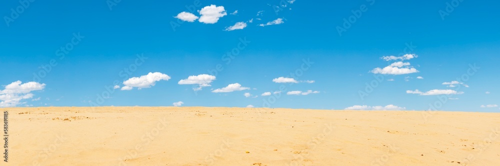 Sand dunes and blue sky with white clouds, natural background. Sand dunes and blue sky with white clouds, natural background.