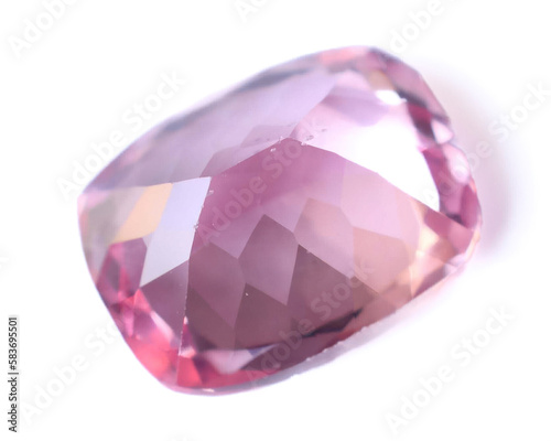 Natural gemstone pink sapphire on gray background