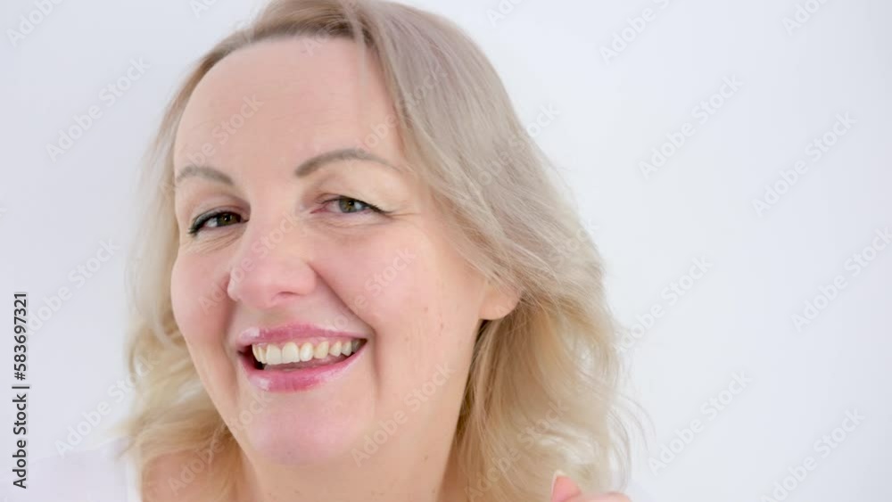 blonde woman dancing waving hands turns her head left and right laughing dancing shrugs her shoulders on a white background making eyes sexy beautiful girl blonde woman dancing waving hands turns her head left and right laughing dancing shrugs her shoulders on a white background making eyes sexy beautiful girl