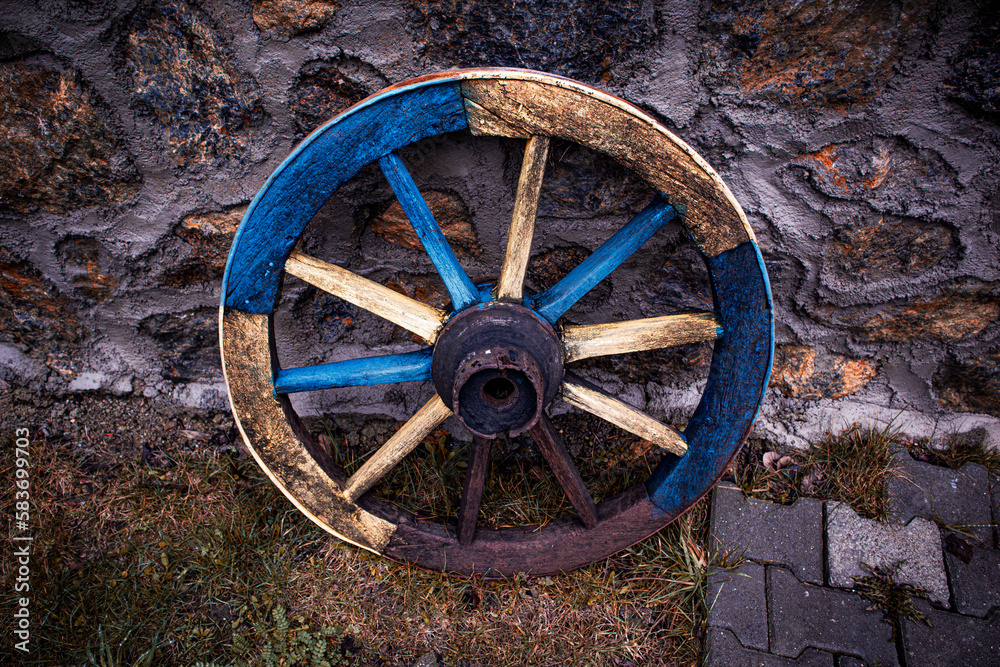 old wagon wheel in a barn