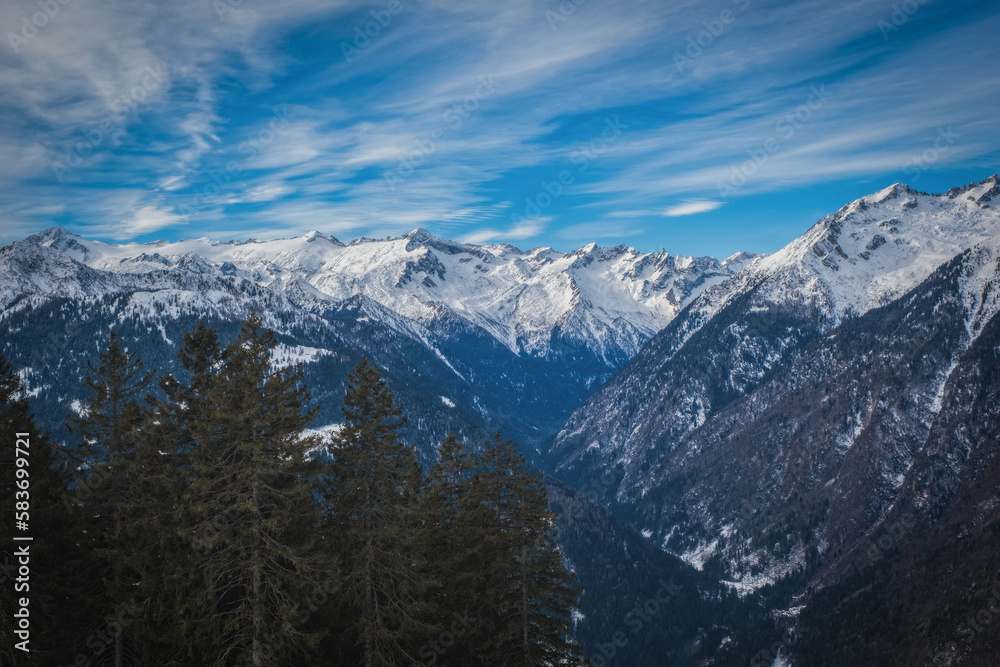 The Dolomites mountains in beautiful winter day. Pinzolo ski resort, Italy. January 2023