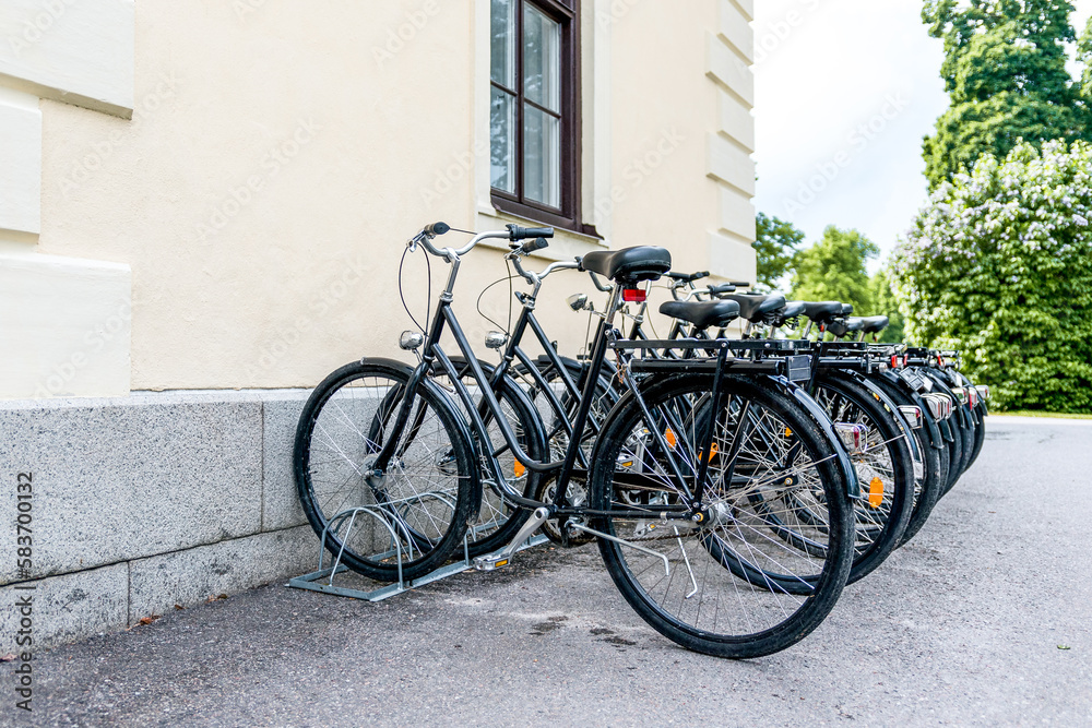 Black bicycles in a row