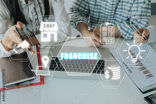 Franchise concept, Business team working on laptop computer with franchise icon on virtual screen.