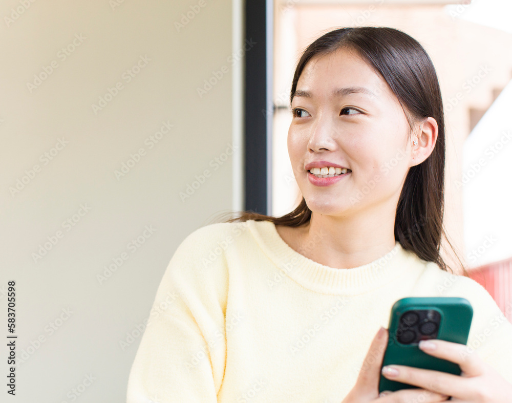 asian pretty woman using a smartphone and shopping at home asian pretty woman using a smartphone and shopping at home