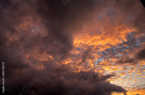 Pink and Orange Sunrise with Storm Clouds.