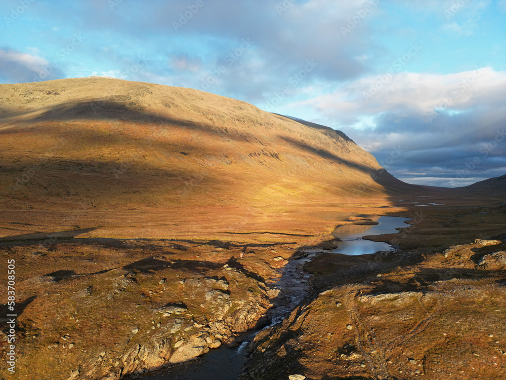 An aerial panorama of the hiking trail between Viterskalet and Syter Mountain Huts, October, Swedish Lapland