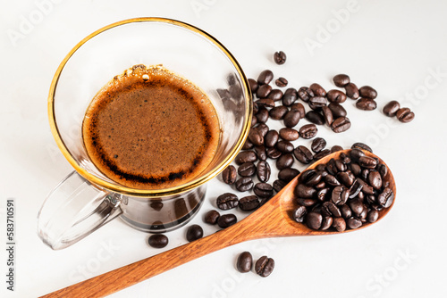 Espresso coffee morning homemade has bean on white wood table. © Nutthikun