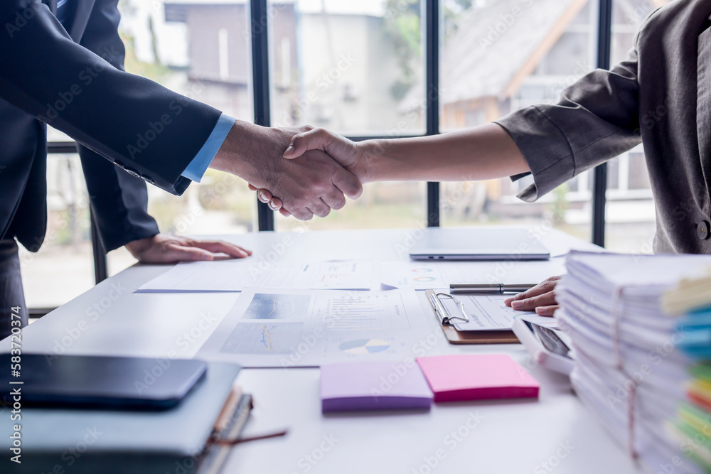 Handshake of businesspeople. Female and male hand makes a handshake in the office.partner to celebration partnership and business deal concept Handshake of businesspeople. Female and male hand makes a handshake in the office.partner to celebration partnership and business deal concept